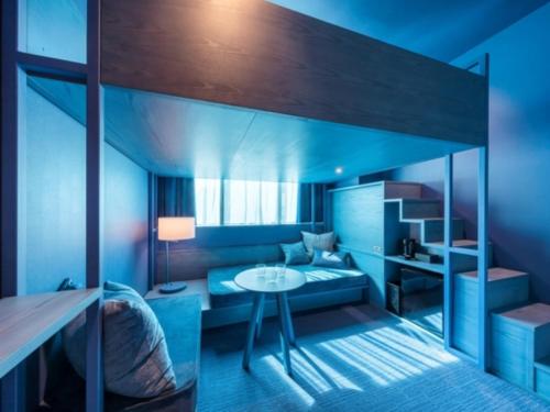 a bedroom with a bunk bed and a table at toggle hotel suidobashi - Vacation STAY 13410v in Tokyo