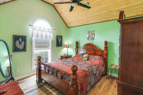 a bedroom with a bed and a ceiling fan at Explore Tupelo & Natchez Trace! Southern Getaway in Tupelo