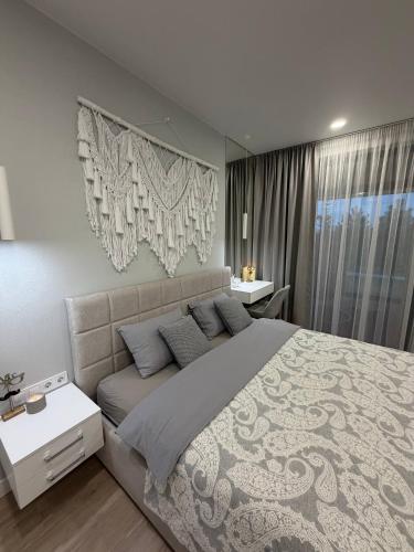 a bedroom with a large bed in a room at Дивоніч guest house in Kyiv