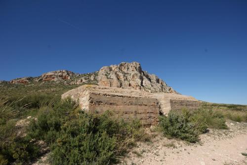 a large rock formation on the side of a hill at Finca El Romeral in Alpera