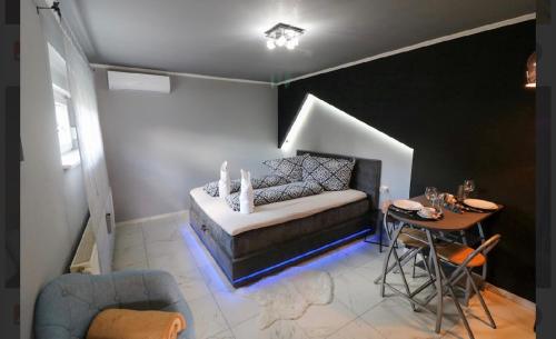 a living room with a couch and a table at KK Vip Apartment in Palić