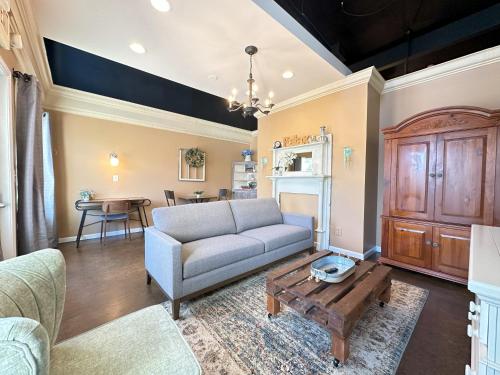 a living room with a couch and a table at Haven at Hazel Downtown Loft in Demorest