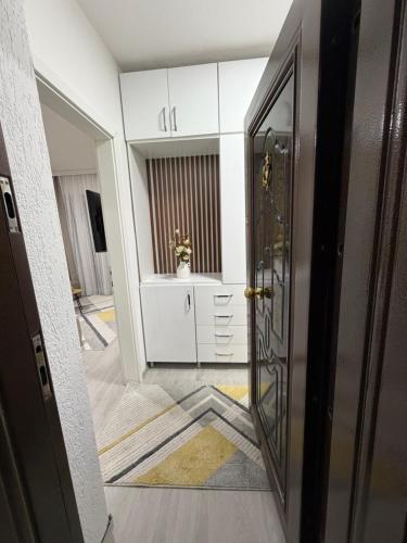 an open door to a hallway with a room at Spring Studio Apartment in Prizren