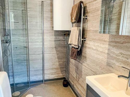 a bathroom with a sink and a shower at 4 star holiday home in SÖLVESBORG in Sölvesborg