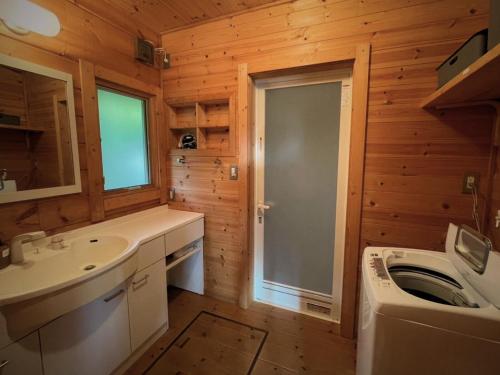a bathroom with a sink and a washing machine at Minamiboso OSORA - Vacation STAY 56344v in Minamiboso