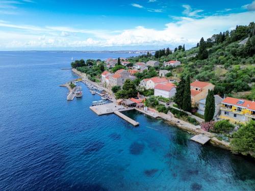 an aerial view of a small town on the water at Apartments Osljak in Preko