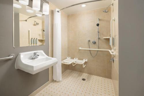 a bathroom with a sink and a shower at Courtyard by Marriott Montvale in Montvale