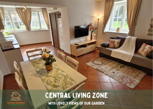 a living room with a table and a couch at Pardubsky Apartments in Ljubljana