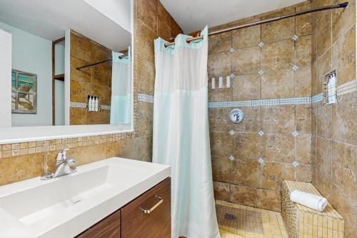 a bathroom with a sink and a shower at Hidden Treasure in Corpus Christi