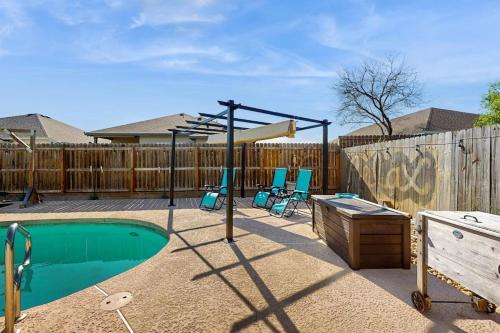 a playground with a trampoline and a swing at Hidden Treasure in Corpus Christi