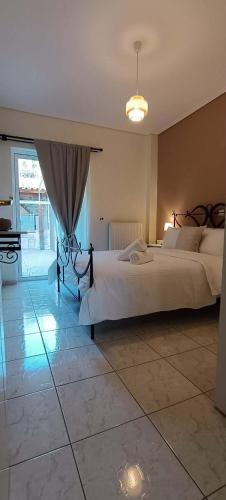 a bedroom with two beds and a piano at Sea & Mountain View Apartment in Chalkida