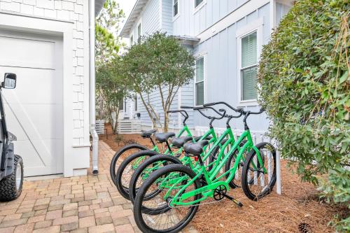 a row of green bikes parked next to a house at SeaPines on 30A in Santa Rosa Beach