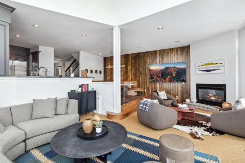 a living room with a couch and a table at Pine Meadows 135 ~ Pine Meadows 135 in Telluride