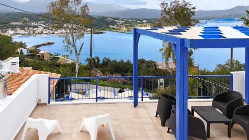 a balcony with a view of the water at Villa Salomon- Seafront Villa with Private Pool in Plaka