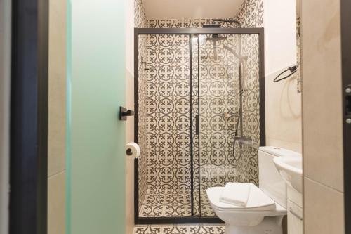 a bathroom with a toilet and a shower at Mihail Residence - Old Town of Kavala in Kavála