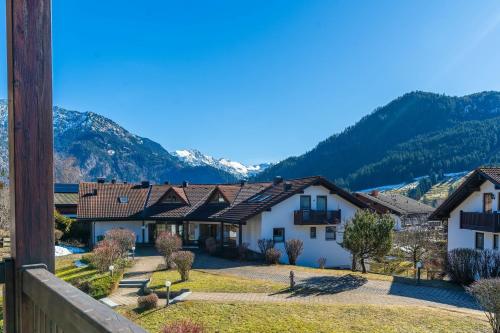 a view of a house with mountains in the background at Bergluft in Bad Hindelang