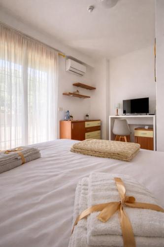 a bedroom with two beds with bows on them at The Mazzitellis Home in Nettuno