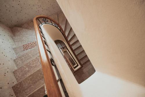 a bathroom door with a mirror on the wall at Casa María Teresa Suites in León