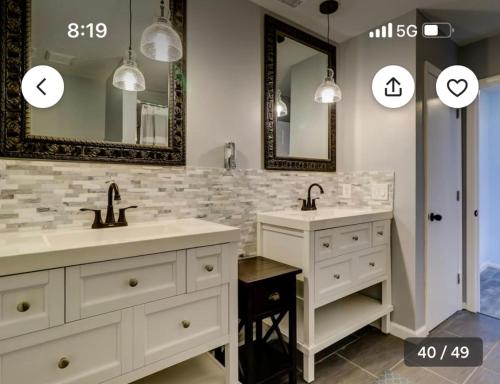 a bathroom with two sinks and two mirrors at Pet Friendly | Pool | Tennis | Walk to Shops in Hilton Head Island