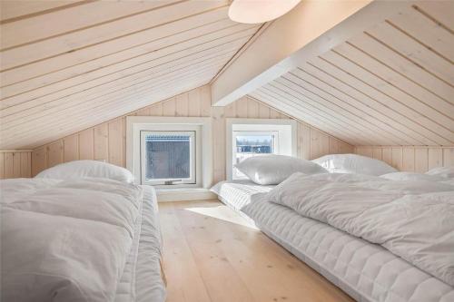 a bedroom with two beds and two windows at 30434-Odder-Strandvaenget-10 in Odder