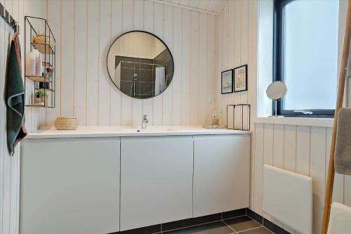 a bathroom with a sink and a mirror at 30458-Odder-Strandvaenget-44 in Odder
