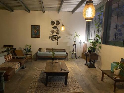 a living room with a couch and a table at Besares 722 in Chacras de Coria