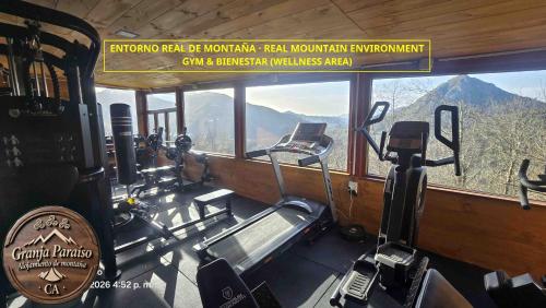 a gym with a view of the mountains at CA Granja Paraíso, Oasis Rural & Bienestar in Cangas de Onís