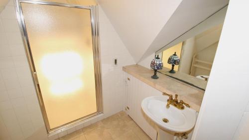a bathroom with a sink and a mirror at The Bayberry House in Cape May