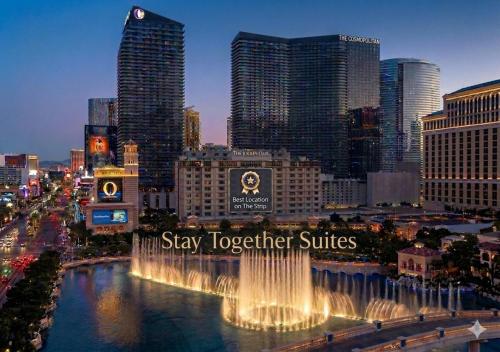 a city with a sign that says stay together cures at Stay Together Suites - Condominium On The Strip Sleeps 16 - NO RESORT FEE in Las Vegas