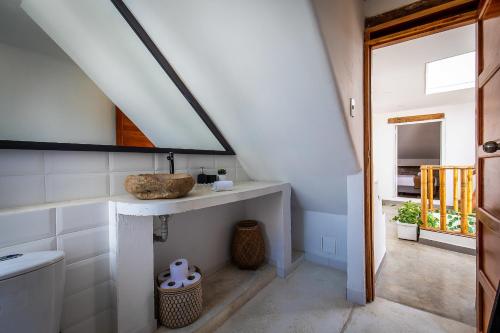 a bathroom with a sink and a mirror at House with Private Pool & Rooftop in Cartagena de Indias