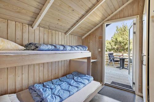 a sauna with two bunk beds and a patio at SL117-Slagelse-Egebaekvej-6 in Slagelse