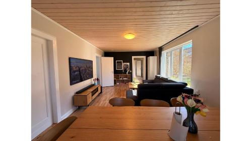 a living room with a couch and a table at Charming Villa - Lalandia & Puttgarden & Femern in Rødby