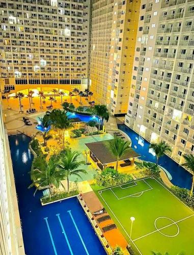 an aerial view of a tennis court in a city at Velour Suites in Manila