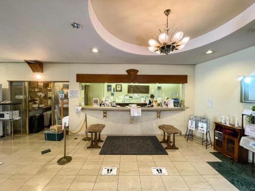 a store with chairs and a counter in a room at Ichihara Marine Hotel - Vacation STAY 01289v in Ichihara