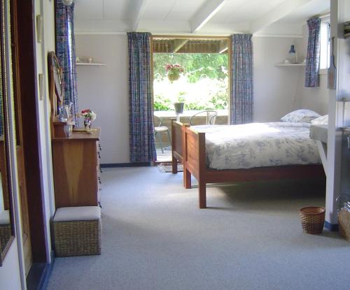 Posteľ alebo postele v izbe v ubytovaní Mairenui Rural Retreat