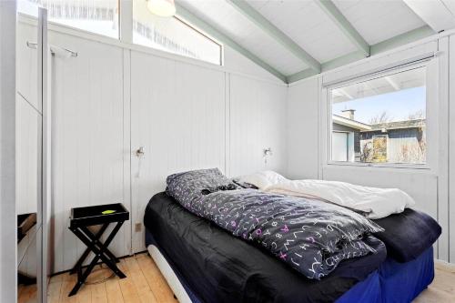a bed in a room with a window at FY298-Faaborg-Dybskrog-12 in Faaborg