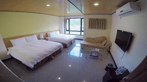 Postel nebo postele na pokoji v ubytování Nantou Sunmoon Lake Walami Homestay B&B