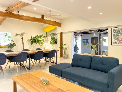 a living room with a couch and a table at SEABASE villa at shimane in Matsue