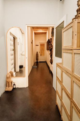 a hallway with a large mirror in a room at Beanstay hostel in Phuket
