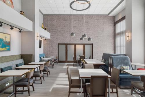 an empty dining room with tables and chairs at Hampton Inn and Suites - Lincoln Northeast in Lincoln