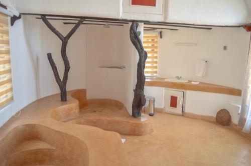a room with a tub in the middle of a room at Maanzoni - Ndoto House ,Athi River by Nest & Nomad in Machakos