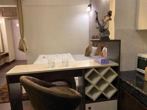 a desk with a chair in a room at Tara Luxury Homes in Solan