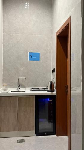 a kitchen with a sink and a counter top at شقق المشرق in Jeddah