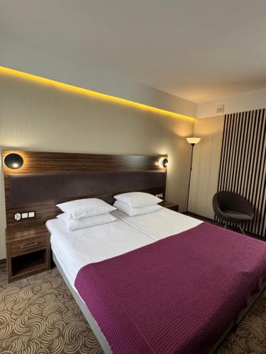 Lova arba lovos apgyvendinimo įstaigoje Hotel Silver