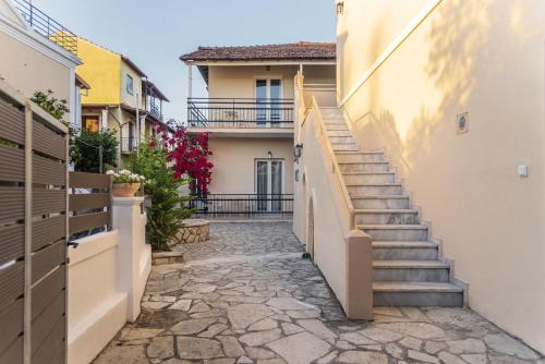 a stairway leading up to a building with stairs at BOHOTEL Eleonas Anex Apartments in Kavos