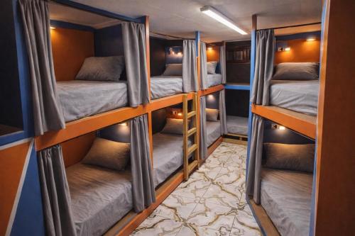 a group of bunk beds in a room at Complexe Smile & Be in Yaoundé