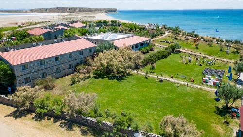 an aerial view of a building and the beach at Gokceada Surf Egitim Merkezi in Gokceada Town