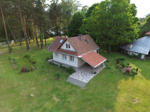 an aerial view of a house with a red roof at PIZUNY Dom pod dębem z balią na wyłączność in Łukawica