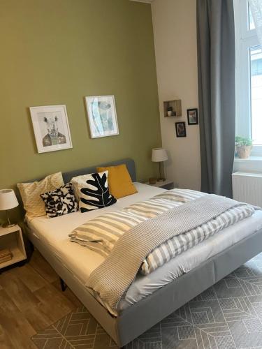 a bedroom with a large bed with pillows on it at Römerburg Apartments Burgstraße in Boppard
