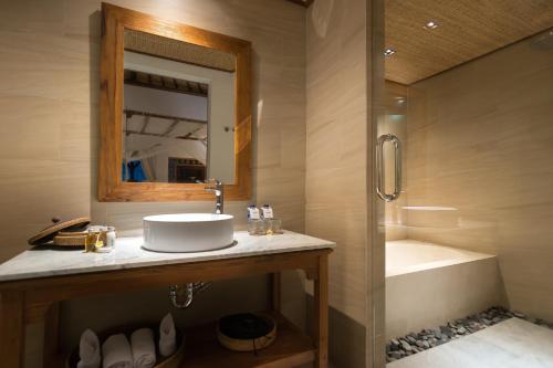a bathroom with a sink and a shower at Ulun Ubud Resort - CHSE Certified in Ubud